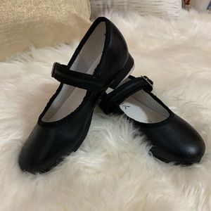 Black Capezio tap shoes with Velcro buckle